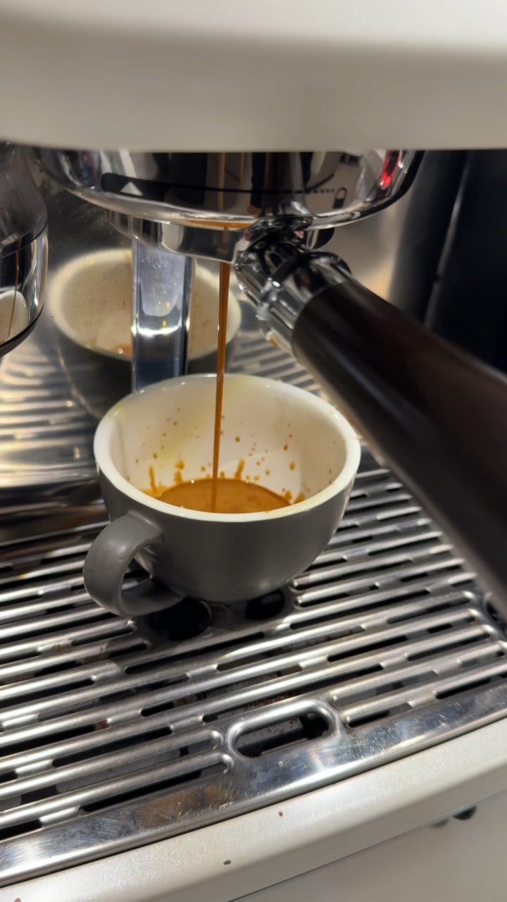 Single clean espresso stream from the Sage Oracle Jet into a grey cup during Ben Murrell's two-month owner test
