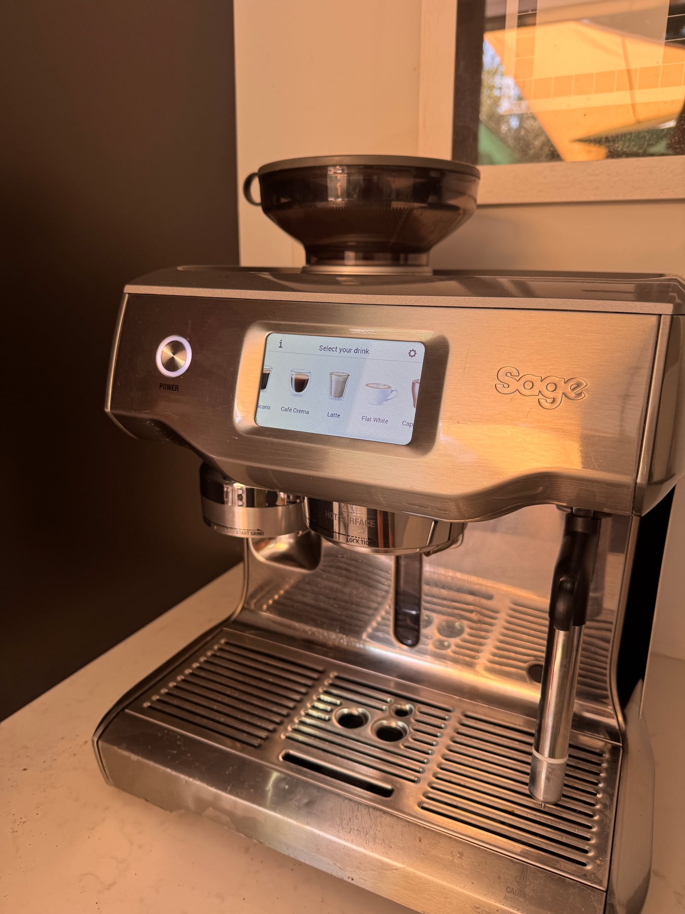 Angled view of Ben Murrell's Sage-branded Oracle Touch showing the touchscreen, grinder and steam wand